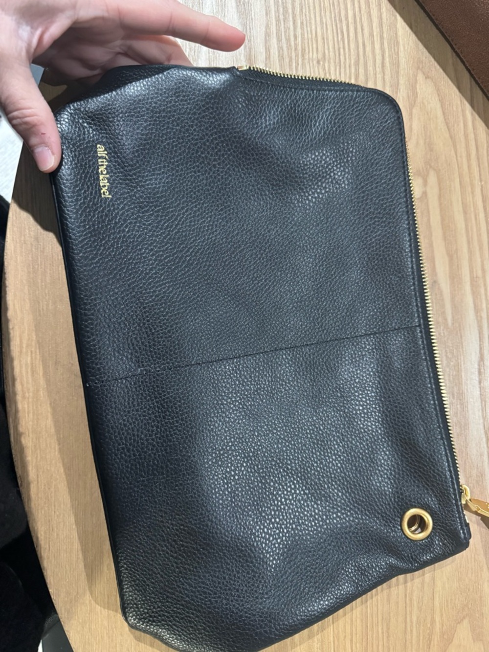 AllTheLabel Black Pebbled Leather Zip Clutch with Gold Hardware